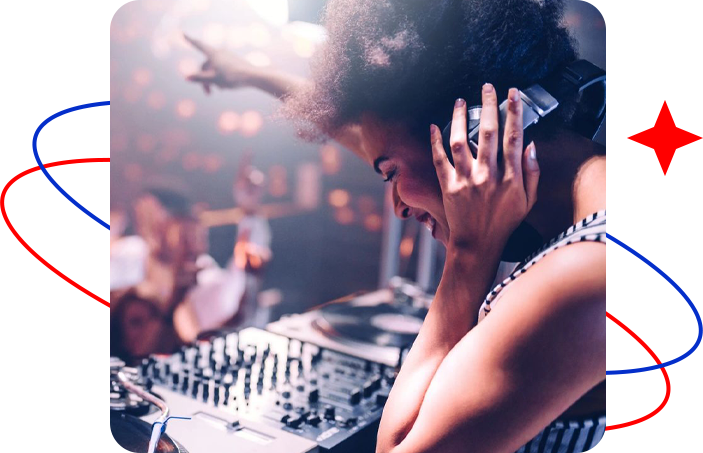 A woman on the phone in front of some dj equipment.