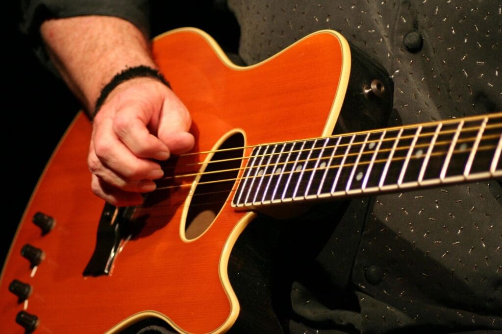 An Image Of A Person Playing A Guitar